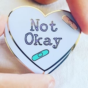 Yami kawaii bandaged heart enamel pin